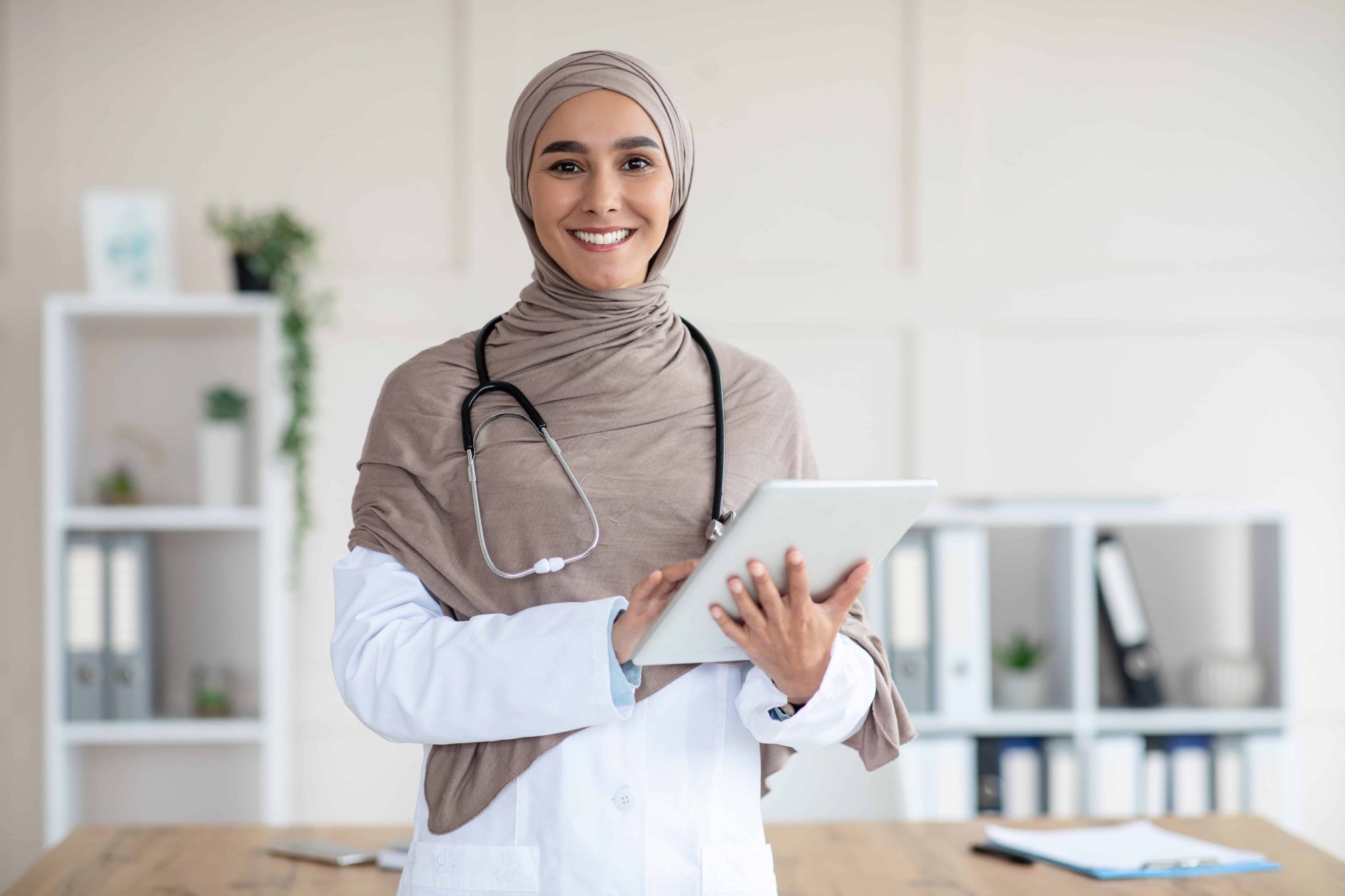 Happy Female Doctor In Hijab With Digital Tablet 2025 03 18 17 15 11 Utc
